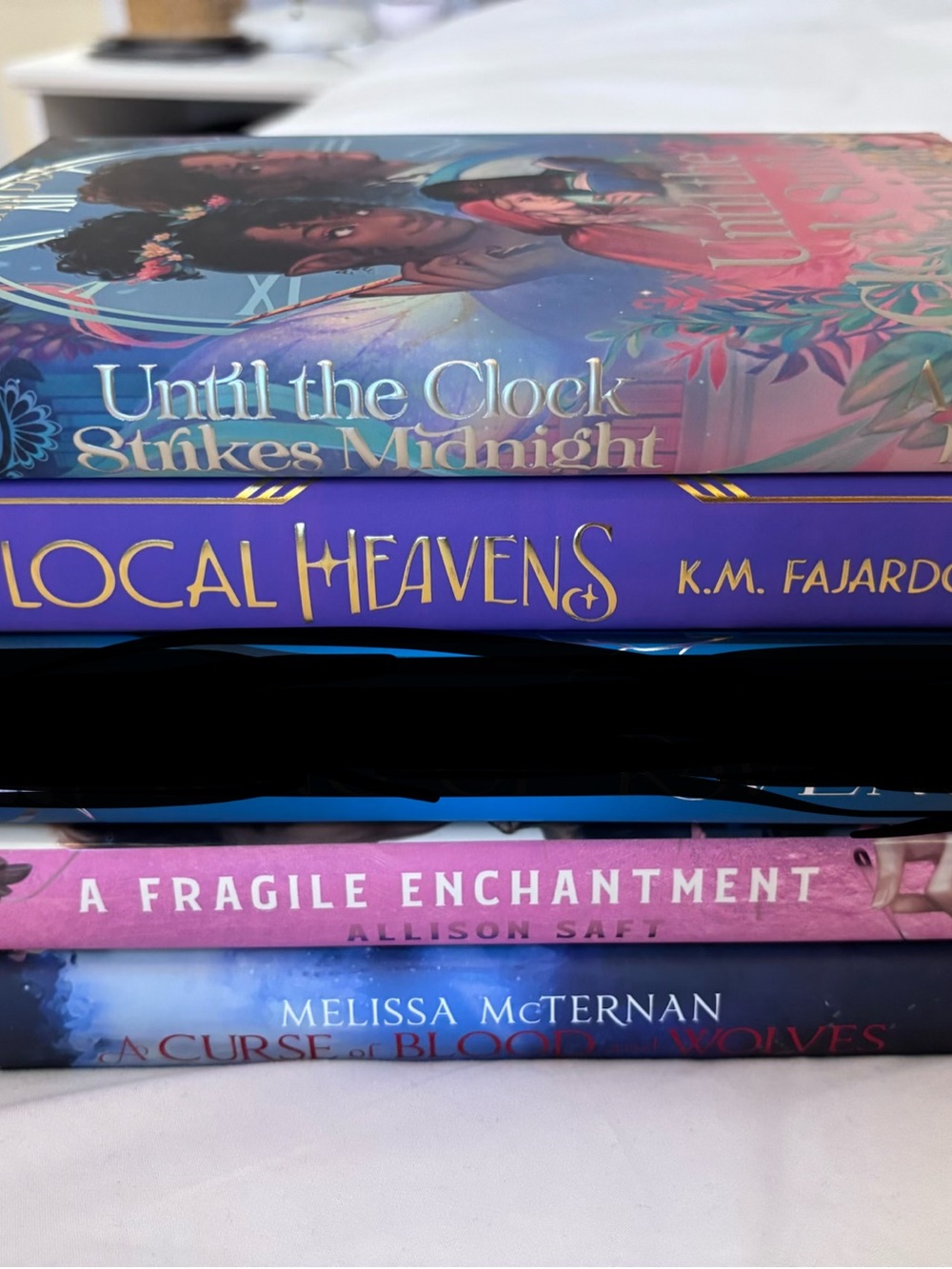 Stack of Decorative Book Spine Accents in Purple and Pink